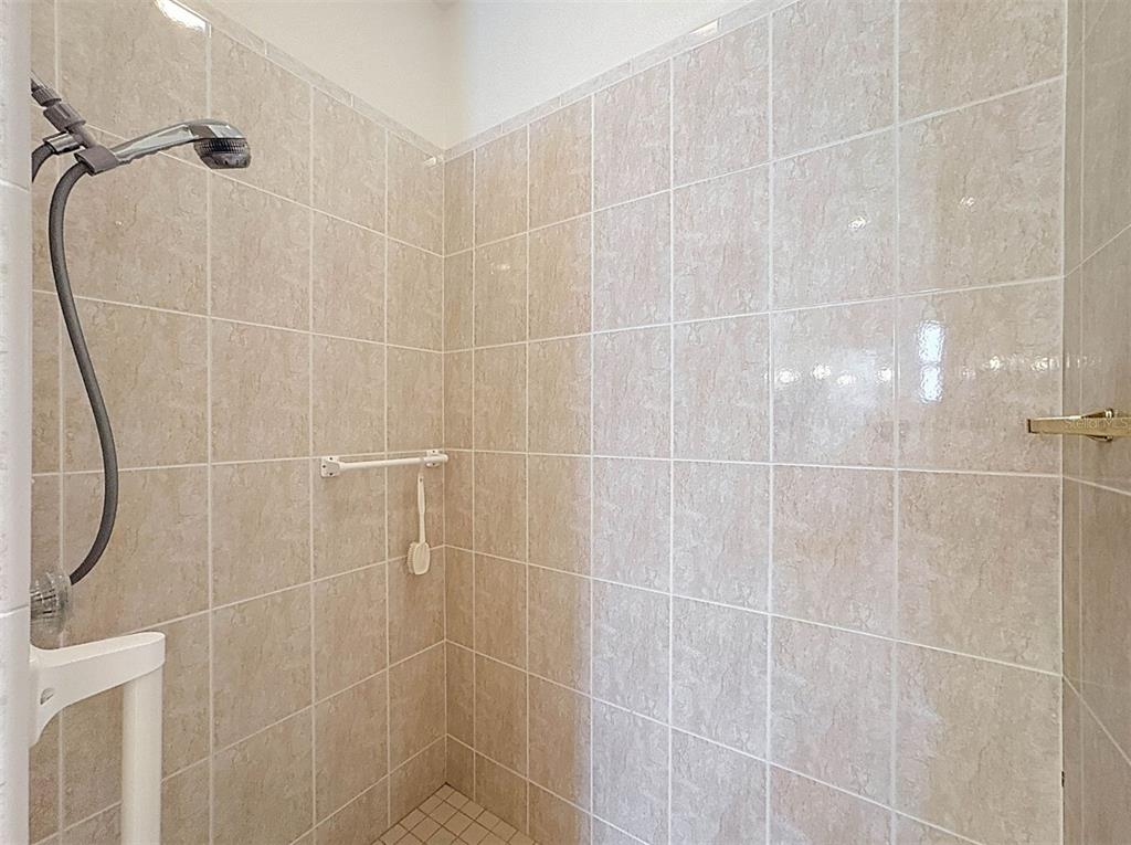 9237 Penelope Drive Weeki Wachee, FL 34613 - Photo 14 of 19 a bathroom with a shower