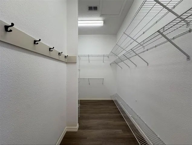 a view of a hallway with stairs