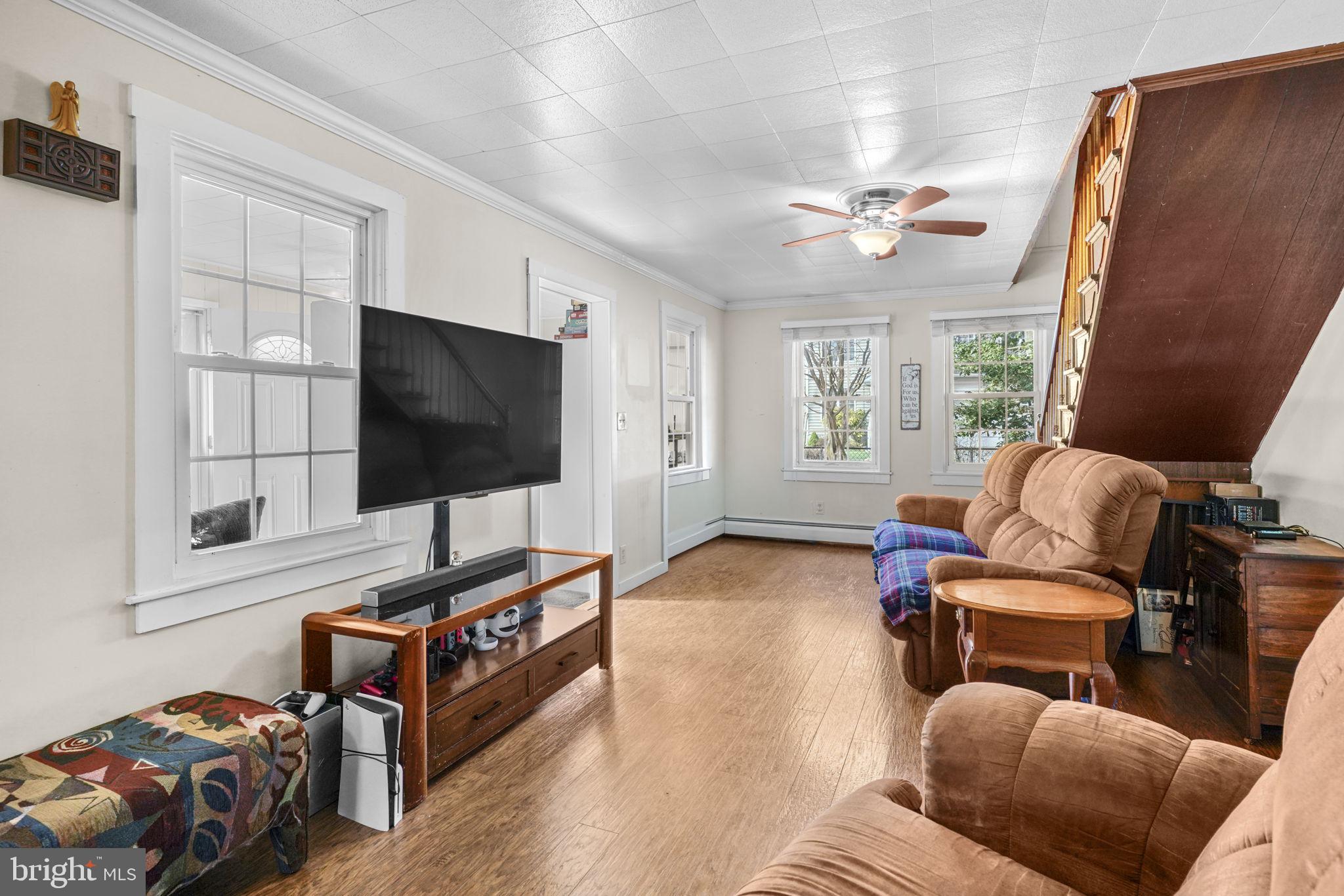 3715 5th Avenue Edgewater, MD 21037 - Photo 11 of 34 a living room with furniture and a flat screen tv
