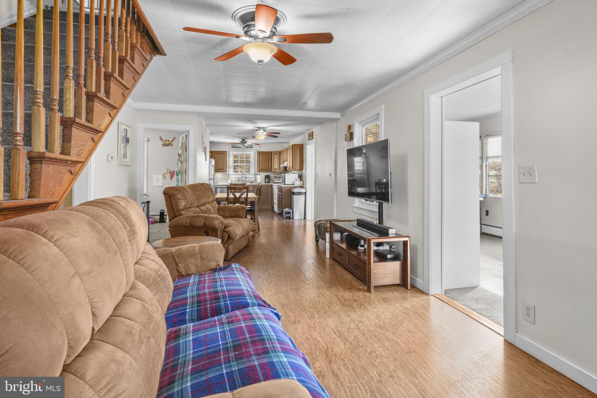 3715 5th Avenue Edgewater, MD 21037 - Photo 12 of 34 a living room with furniture or couch and a chandelier