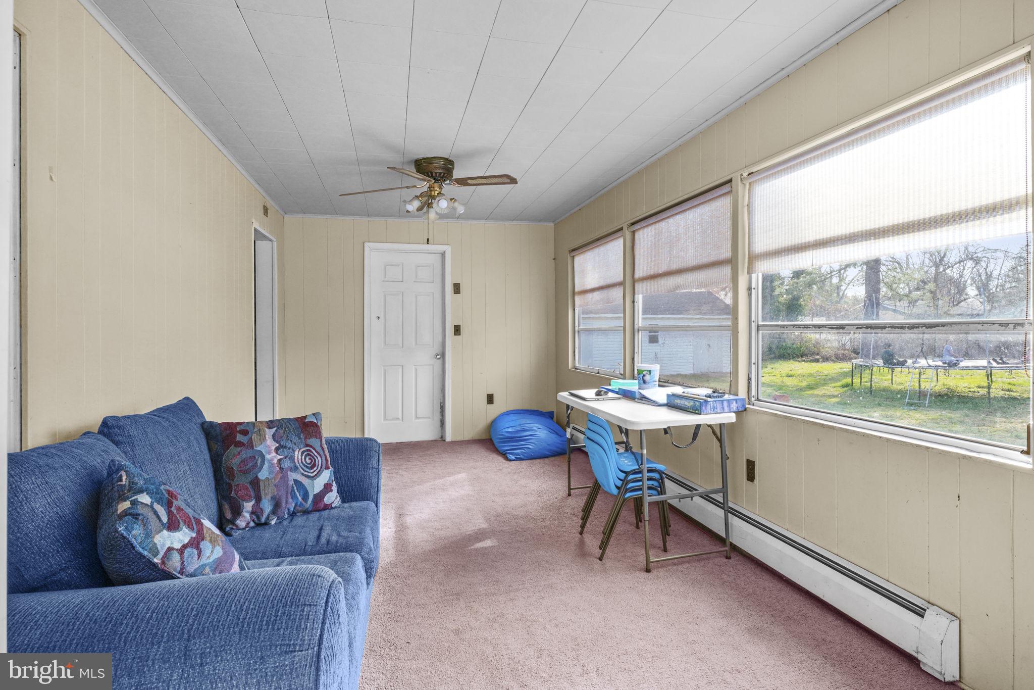 3715 5th Avenue Edgewater, MD 21037 - Photo 15 of 34 a living room with furniture and a large window