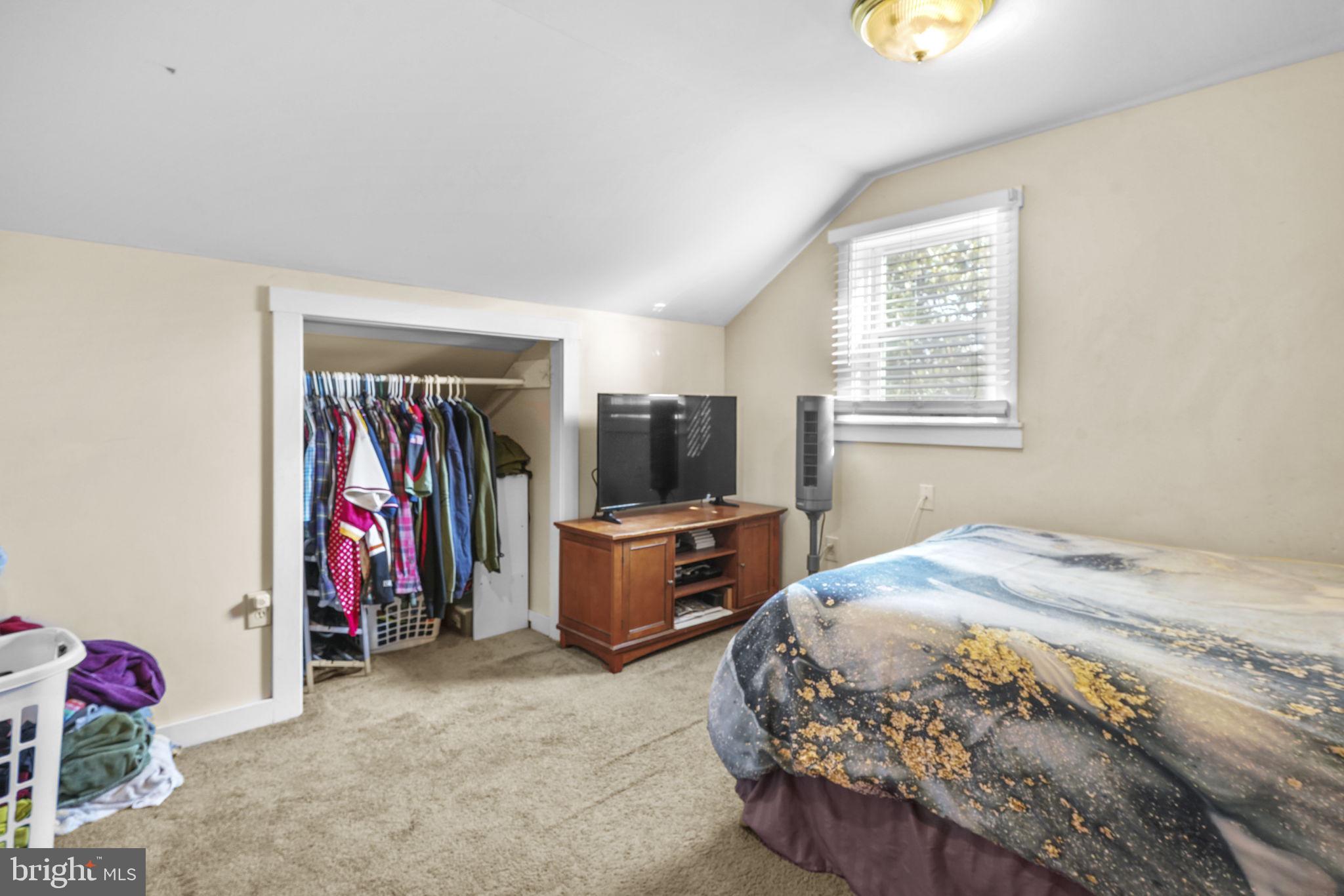 3715 5th Avenue Edgewater, MD 21037 - Photo 21 of 34 a bed room with a bed and a television