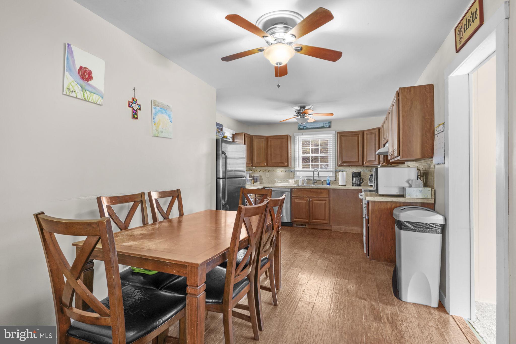 3715 5th Avenue Edgewater, MD 21037 - Photo 6 of 34 a view of a dining room with furniture and a kitchen