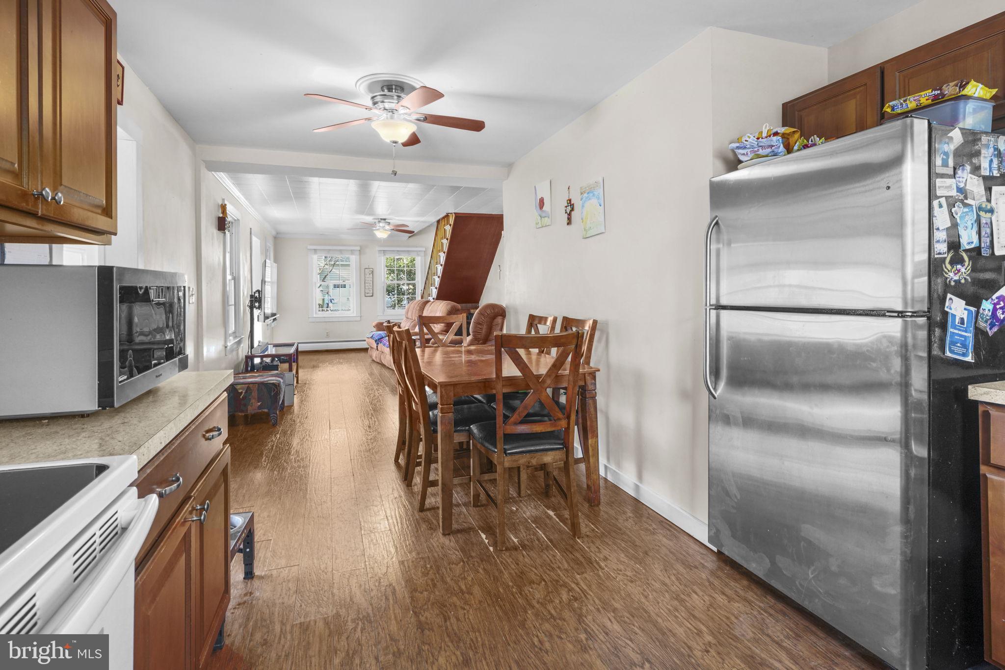 3715 5th Avenue Edgewater, MD 21037 - Photo 9 of 34 a dining room with furniture and wooden floor