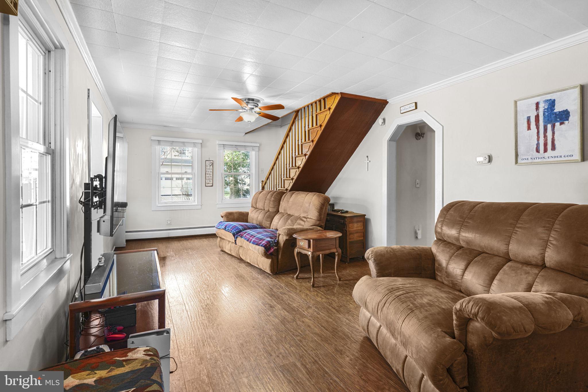 3715 5th Avenue Edgewater, MD 21037 - Photo 10 of 34 a living room with furniture and a wooden floor