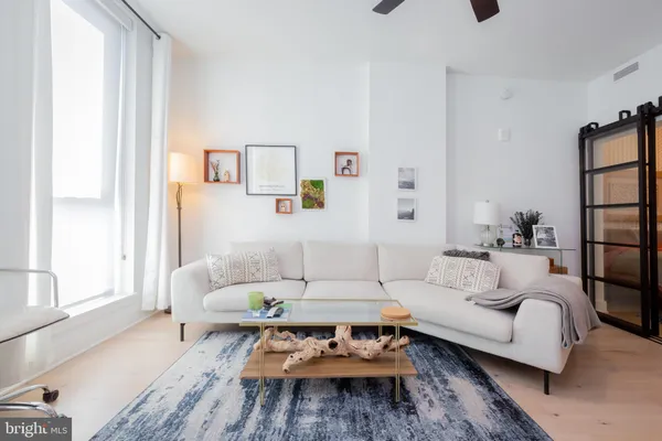 a living room with furniture and a rug
