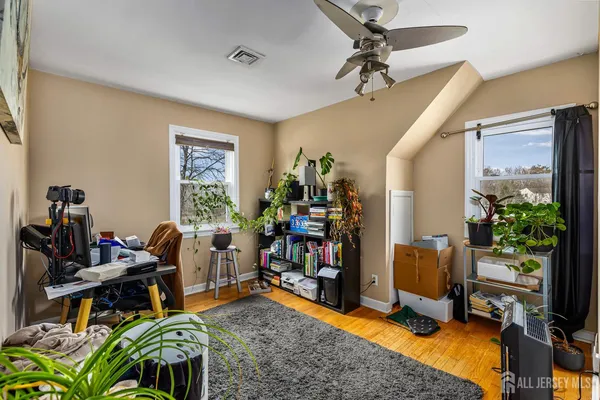 a view of a workspace with furniture and a livingroom