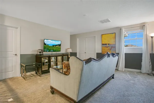 a living room with furniture and a window