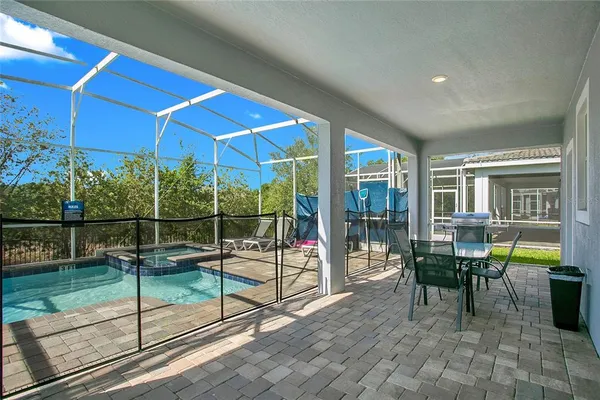 a view of a porch with chairs and couches
