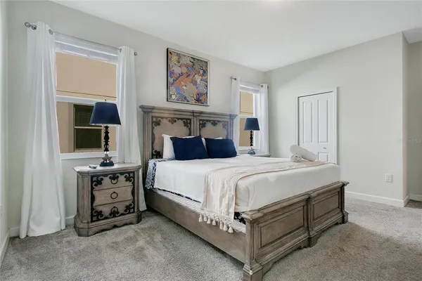 a bedroom with a bed and a tv