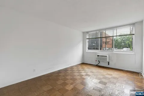 a room with a cabinet and a window