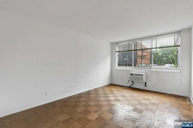 a room with a cabinet and a window