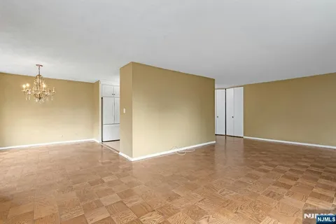 a view of an empty room with a wooden door