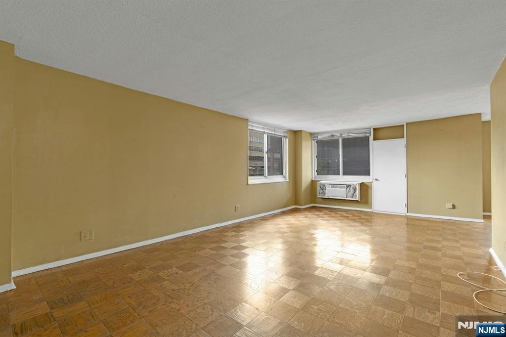 2150 Center Avenue, Unit 2E Fort Lee, NJ 07024 - Photo 5 of 34 a view of an empty room with a window