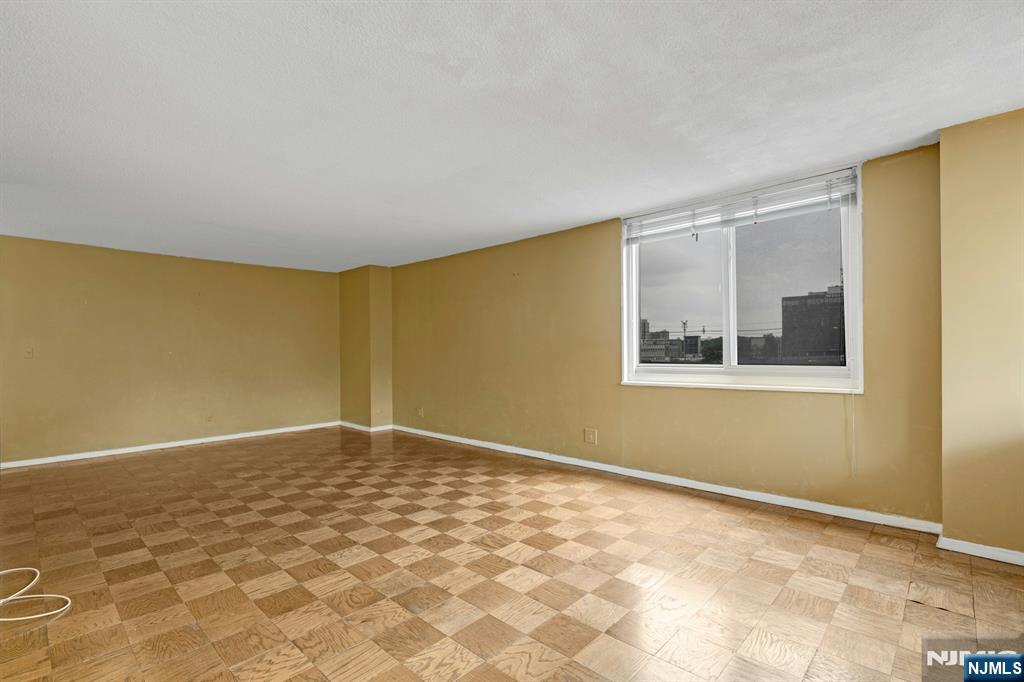 2150 Center Avenue, Unit 2E Fort Lee, NJ 07024 - Photo 6 of 34 a view of an empty room with a window