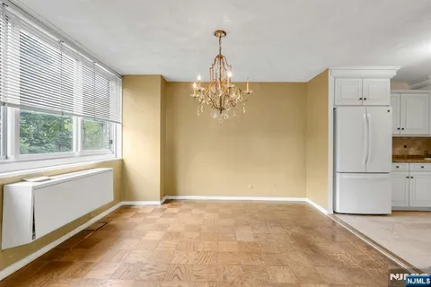 a view of a kitchen with a dishwasher cabinets and a large window