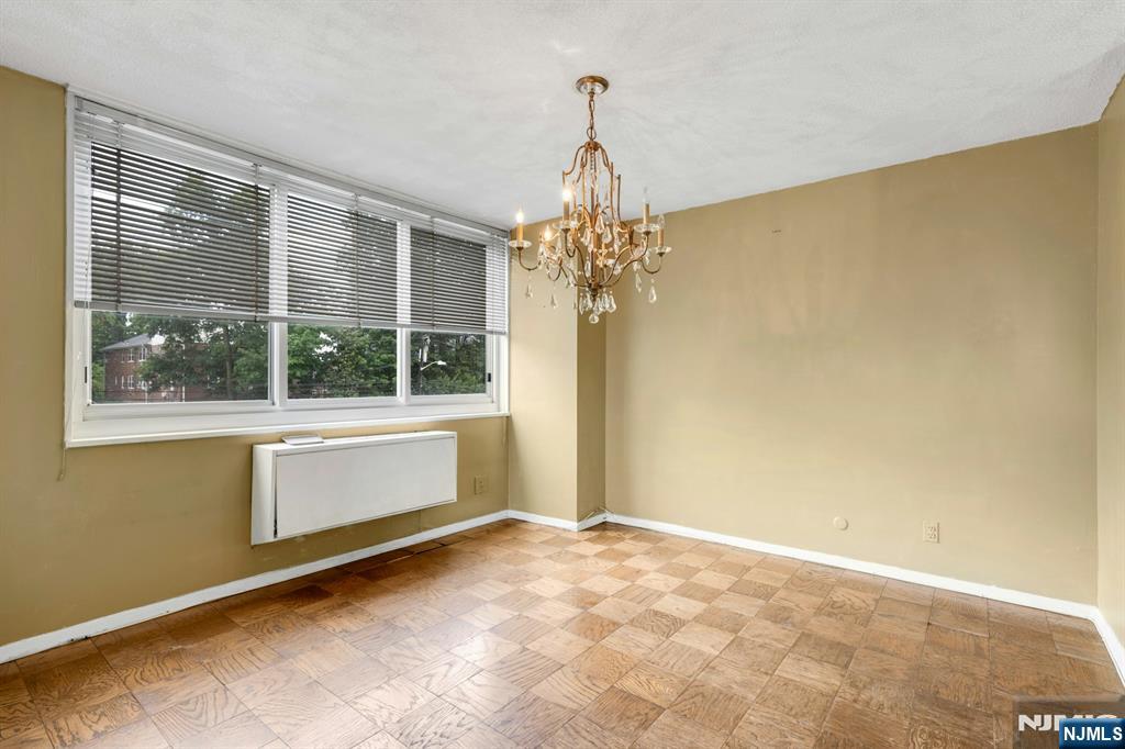 2150 Center Avenue, Unit 2E Fort Lee, NJ 07024 - Photo 9 of 34 a view of an empty room with a window