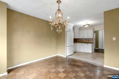 a view of a kitchen with a sink and cabinets