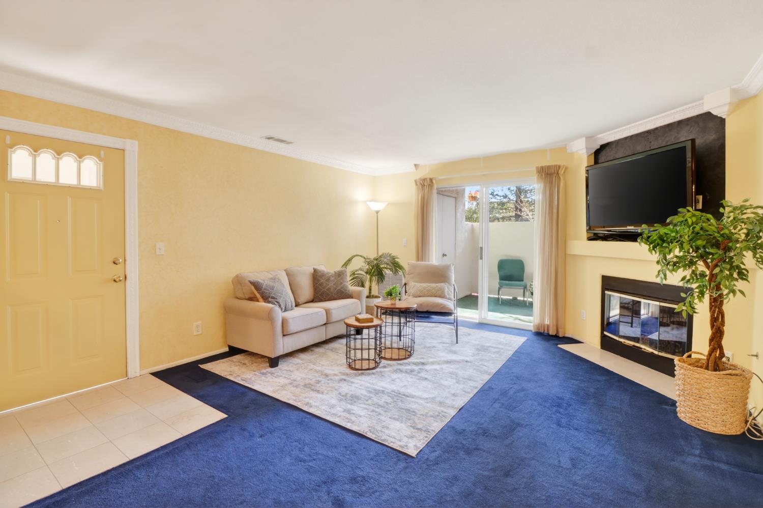8020 Walerga Road, Unit 1009 Antelope, CA 95843 - Photo 2 of 39 Living room with gas fireplace and outside access to patio