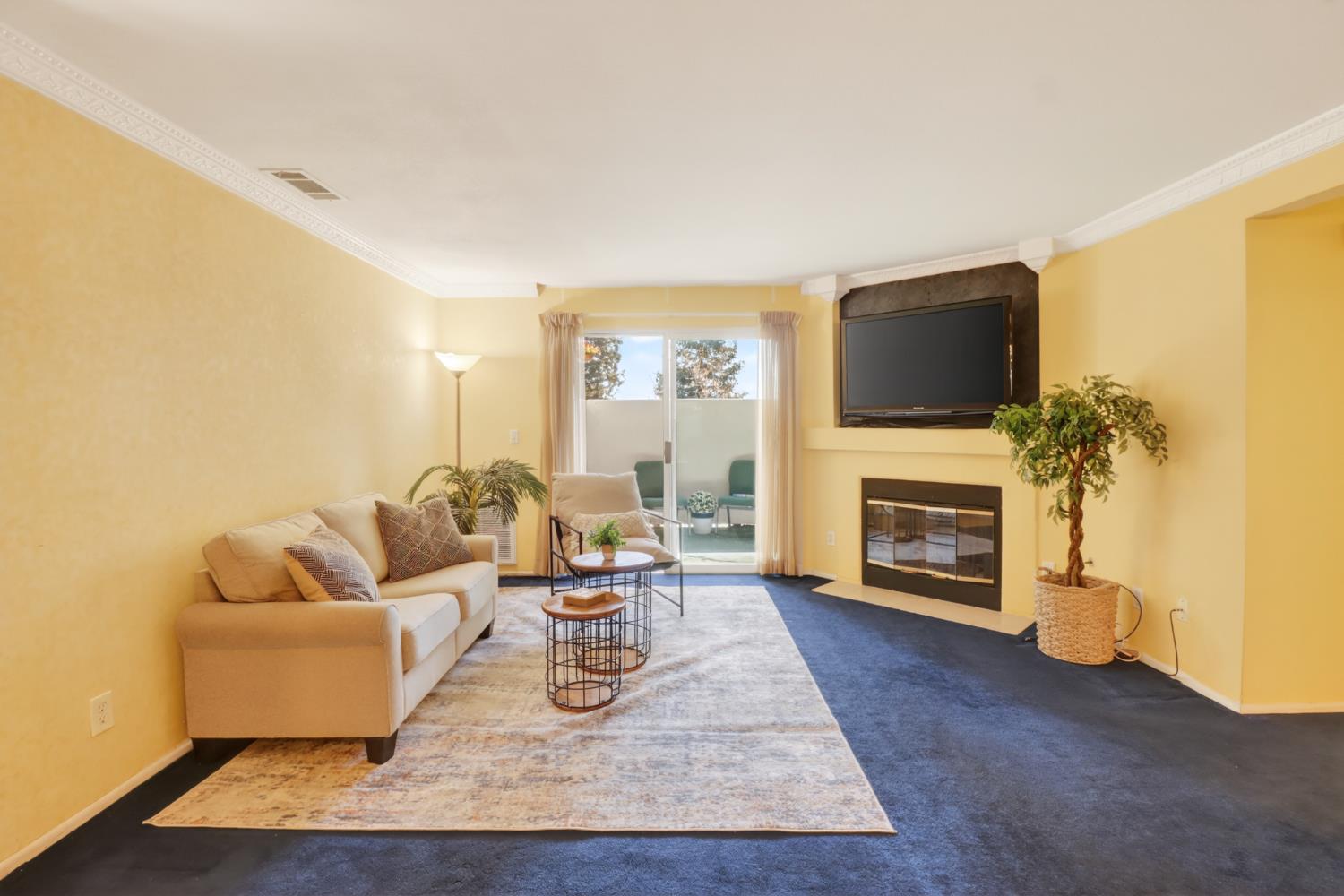 8020 Walerga Road, Unit 1009 Antelope, CA 95843 - Photo 8 of 39 Gas fireplace with TV mounted above