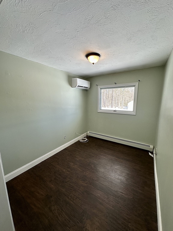 35 Princeton Street Gardner, MA 01440 - Photo 11 of 23 an empty room with wooden floor and windows