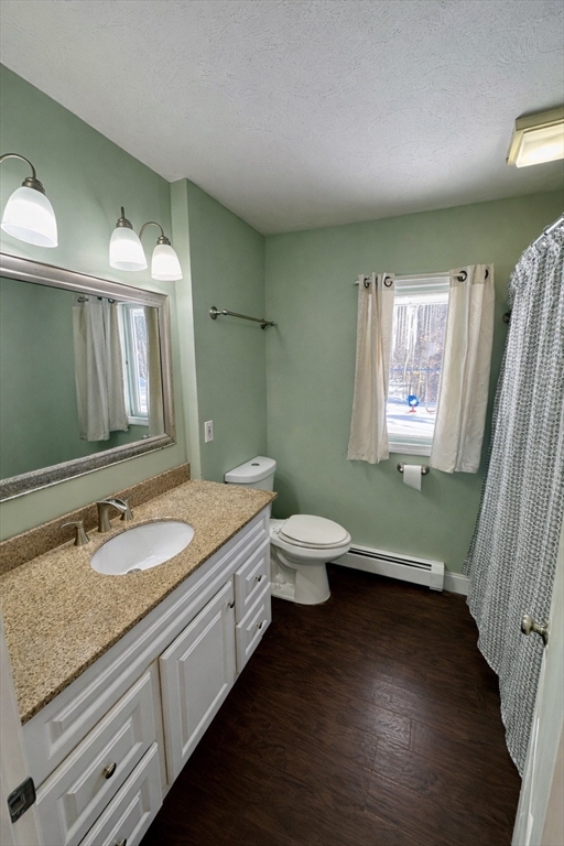 35 Princeton Street Gardner, MA 01440 - Photo 12 of 23 a bathroom with a granite countertop toilet sink and mirror