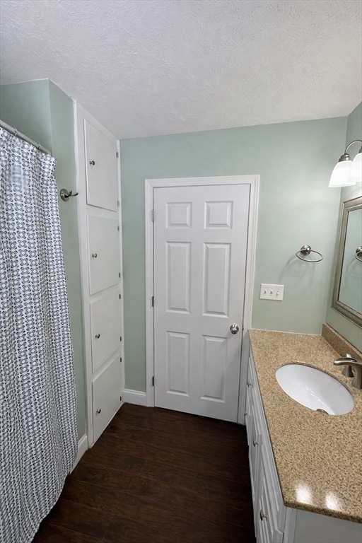 35 Princeton Street Gardner, MA 01440 - Photo 13 of 23 a bathroom with a granite countertop sink and a mirror