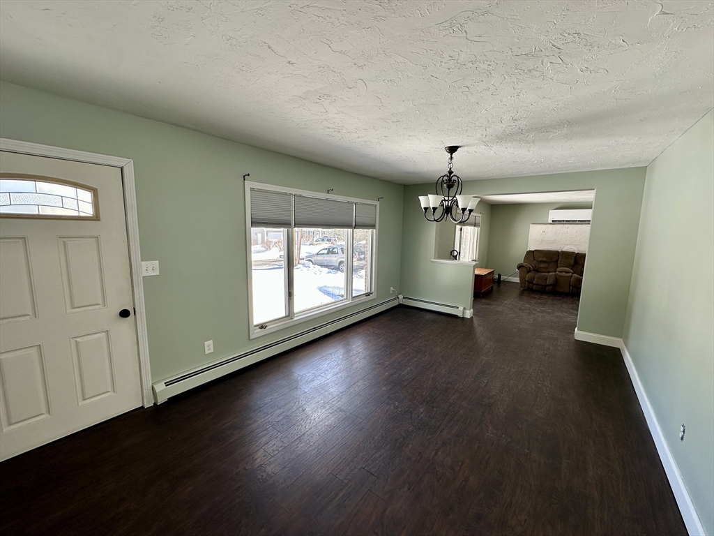 35 Princeton Street Gardner, MA 01440 - Photo 14 of 23 an empty room with wooden floor and windows