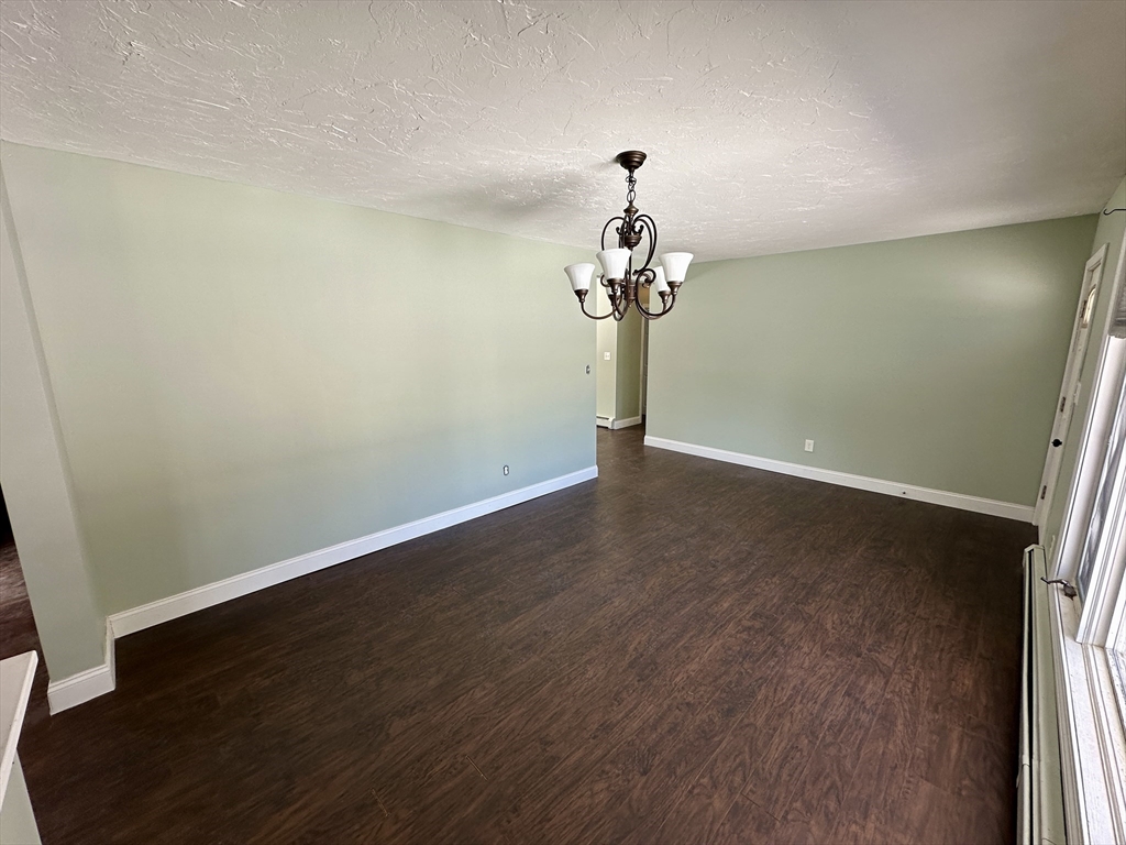 35 Princeton Street Gardner, MA 01440 - Photo 15 of 23 an empty room with a mirror