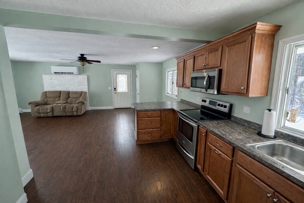 35 Princeton Street Gardner, MA 01440 - Photo 5 of 23 a kitchen with stainless steel appliances granite countertop a sink a stove top oven a counter space and cabinets