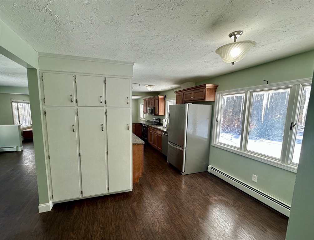 35 Princeton Street Gardner, MA 01440 - Photo 6 of 23 a view of kitchen with refrigerator and wooden floor