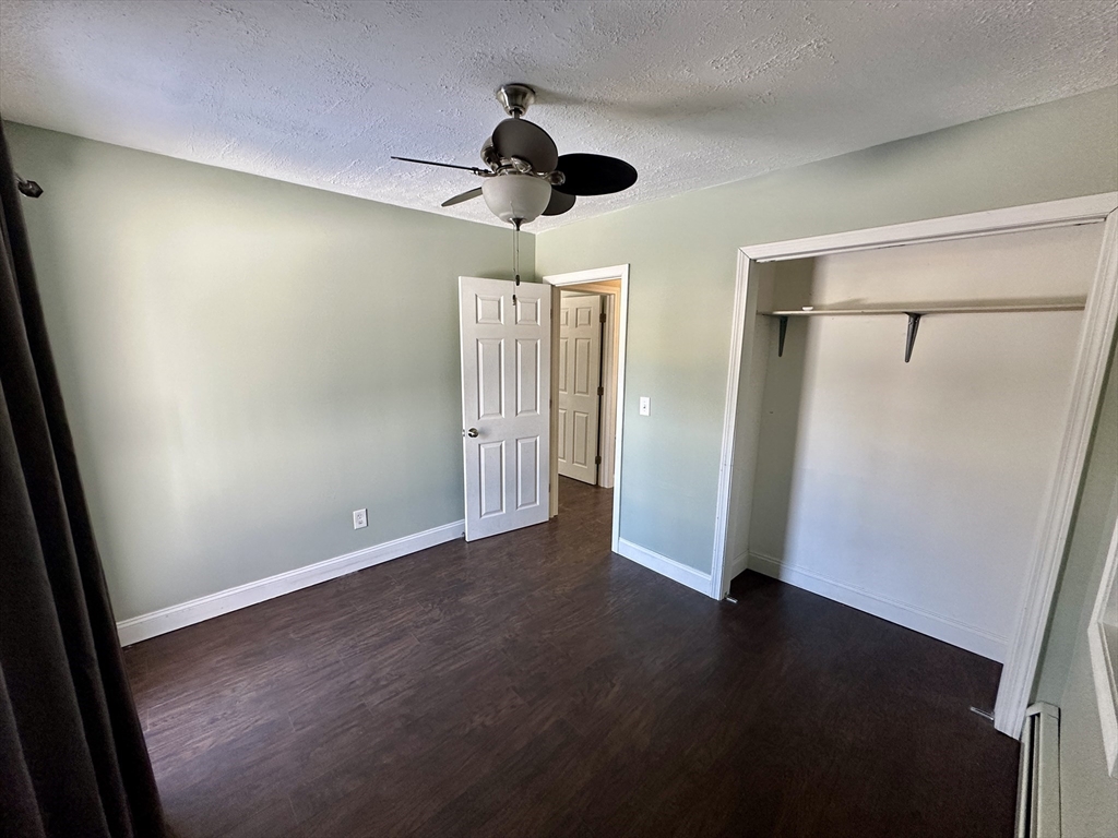 35 Princeton Street Gardner, MA 01440 - Photo 8 of 23 an empty room with wooden floor wooden floor and closet