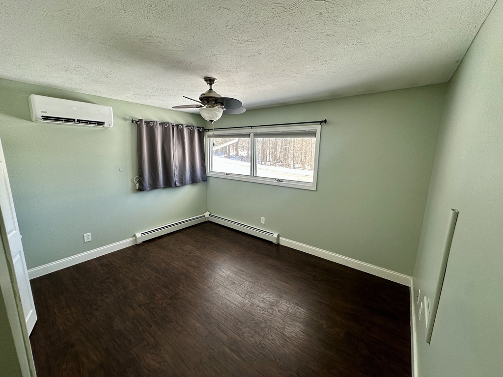 35 Princeton Street Gardner, MA 01440 - Photo 9 of 23 an empty room with wooden floor and windows