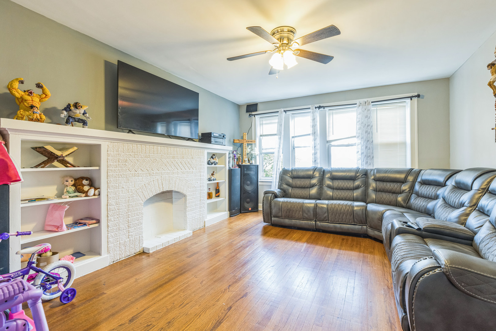 2913 West 63rd Street Chicago, IL 60629 - Photo 13 of 20 a living room with furniture and a fireplace