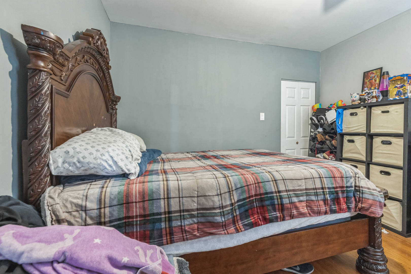 2913 West 63rd Street Chicago, IL 60629 - Photo 15 of 20 a bedroom with a bed a dresser and book shelf