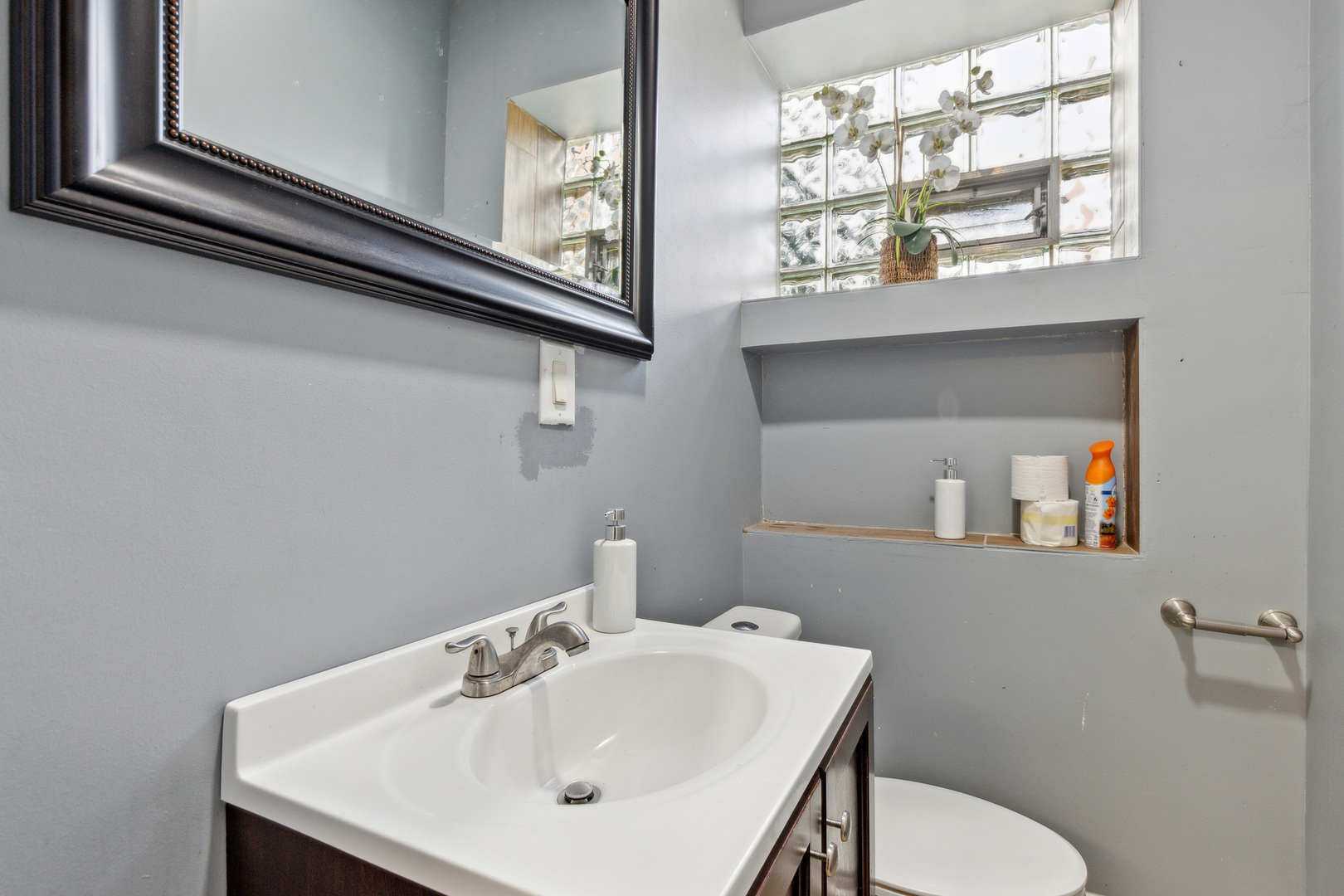 2913 West 63rd Street Chicago, IL 60629 - Photo 7 of 20 a bathroom with a sink and a toilet