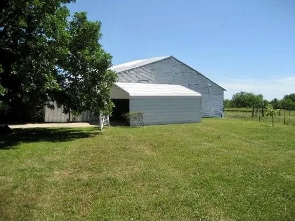 a backyard of a house with lots of green space