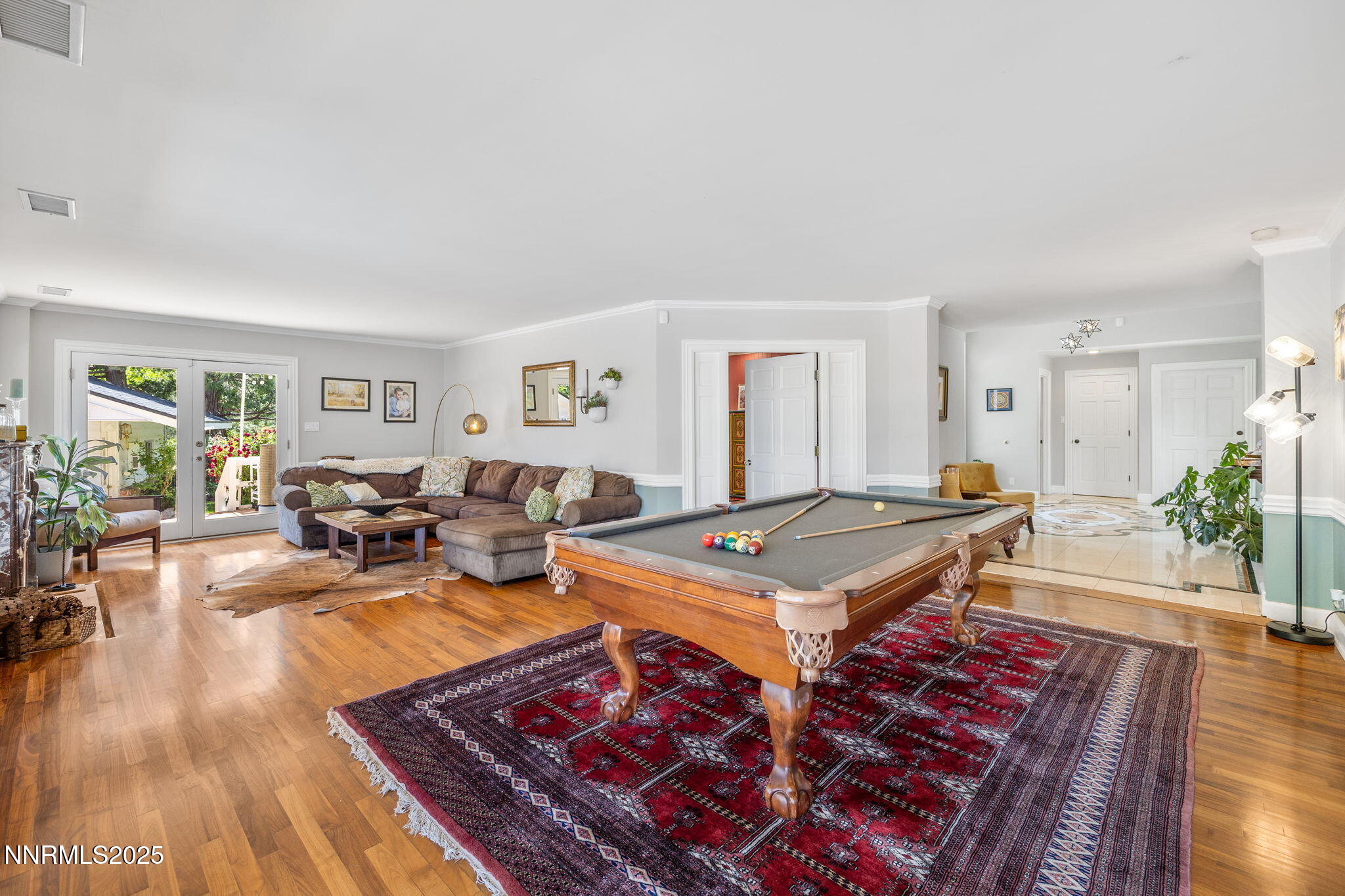 1855 Sierra Sage Lane Reno, NV 89509 - Photo 11 of 34 a living room with furniture pool table and a wooden floor