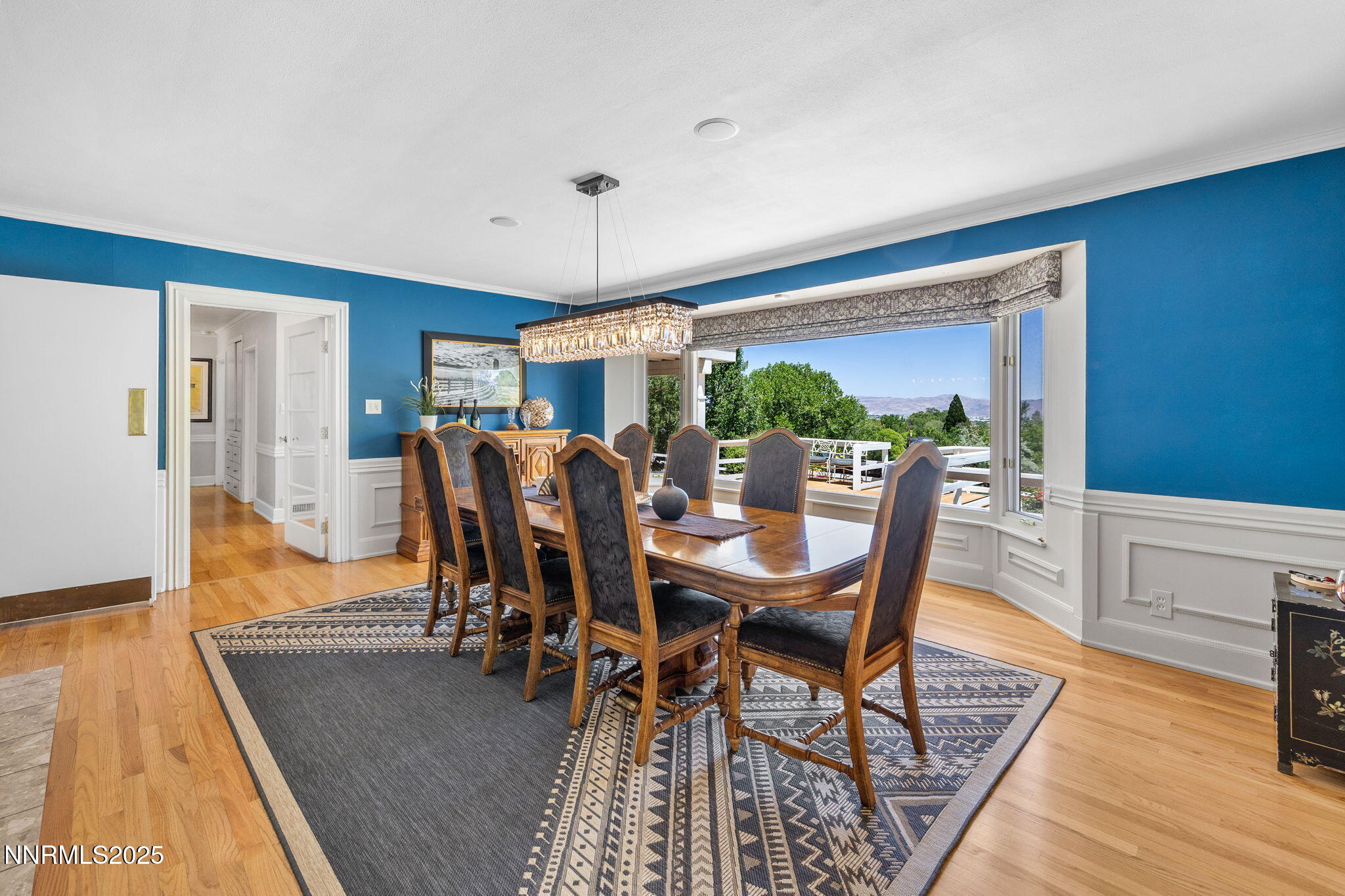 1855 Sierra Sage Lane Reno, NV 89509 - Photo 14 of 34 a view of a dining room with furniture and wooden floor