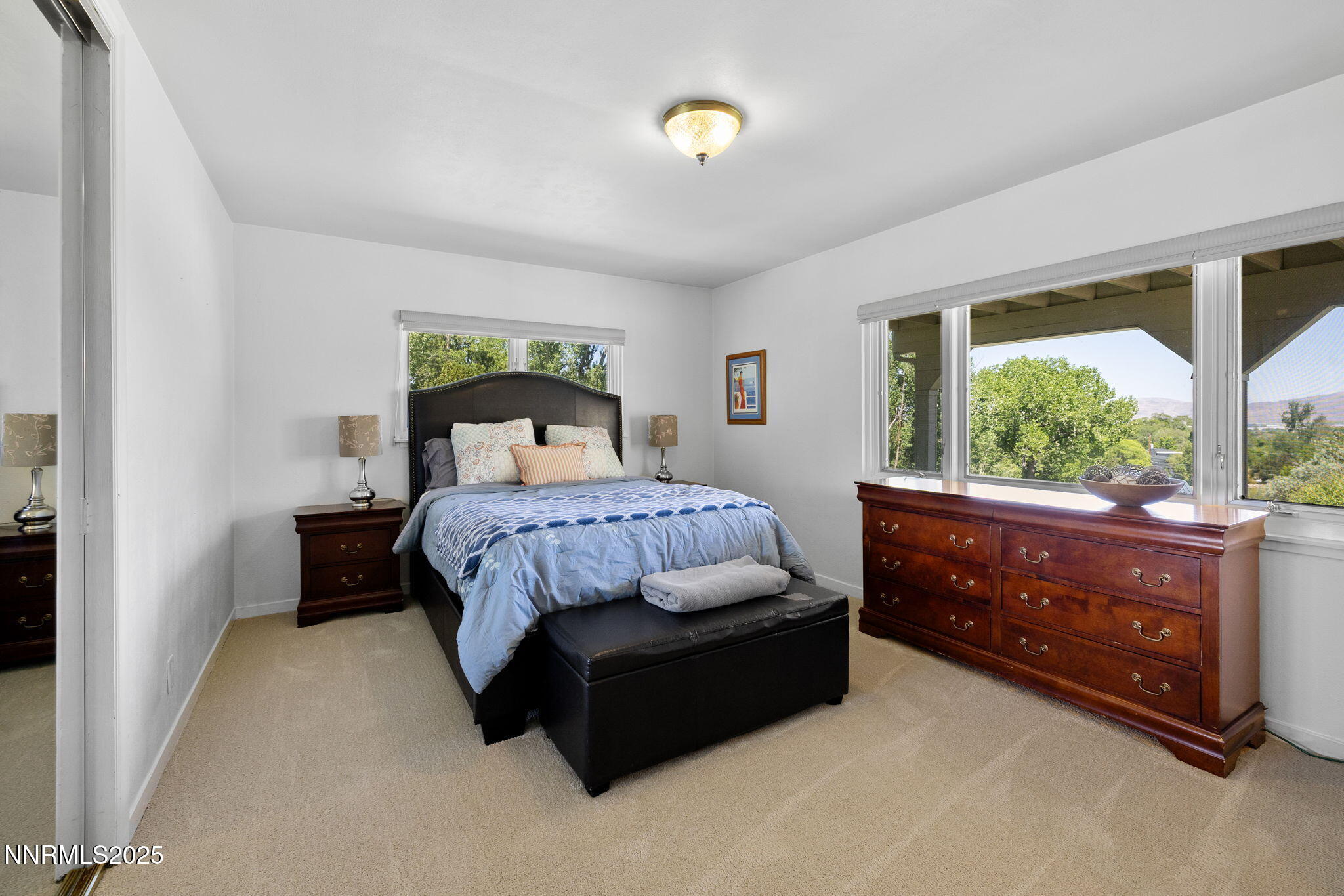 1855 Sierra Sage Lane Reno, NV 89509 - Photo 21 of 34 a bedroom with a bed and window