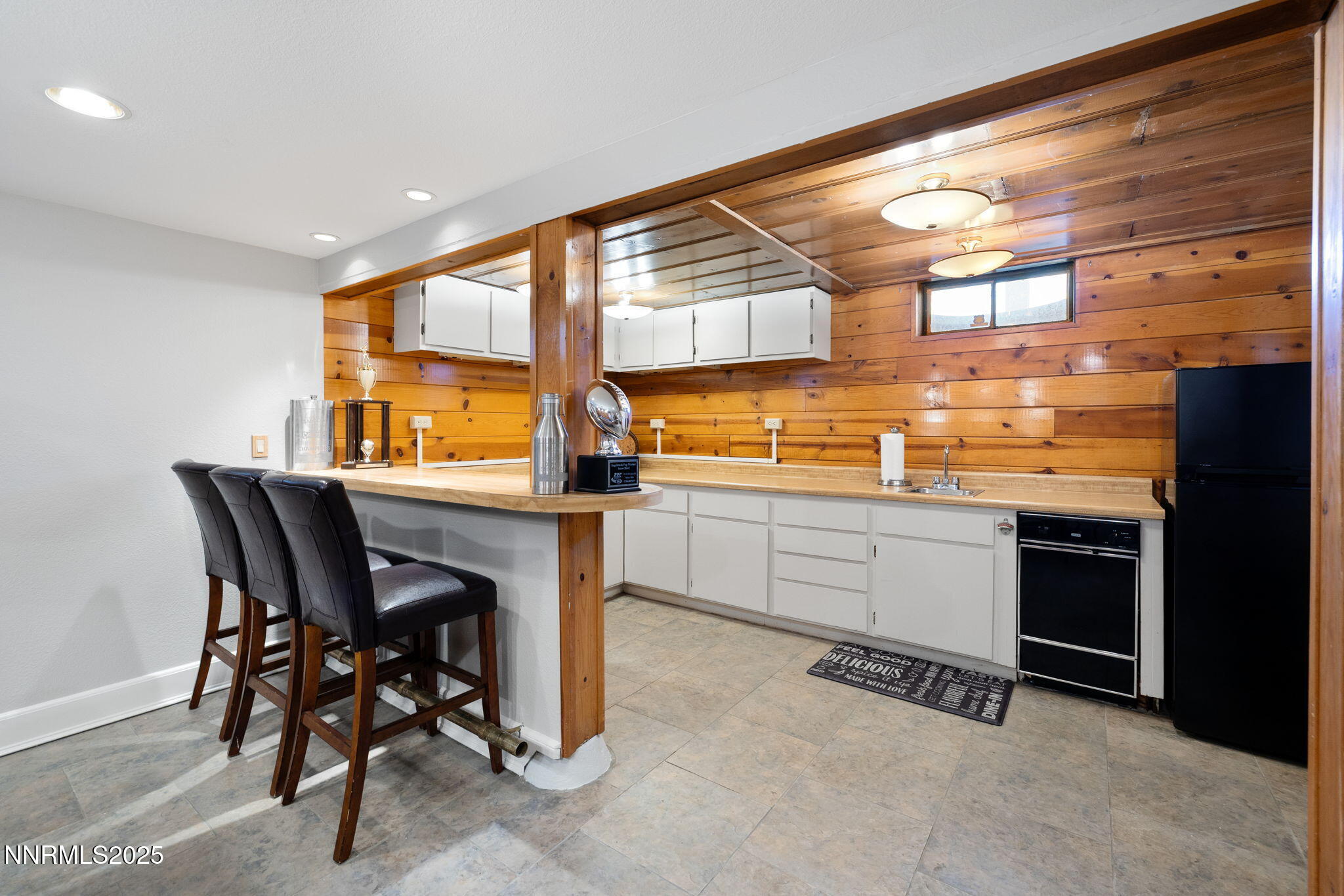 1855 Sierra Sage Lane Reno, NV 89509 - Photo 24 of 34 a kitchen with a table and chairs