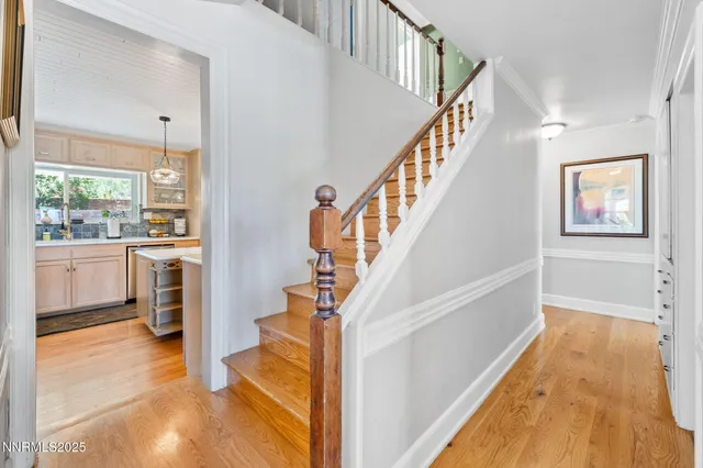 a view of a kitchen with furniture and staircase