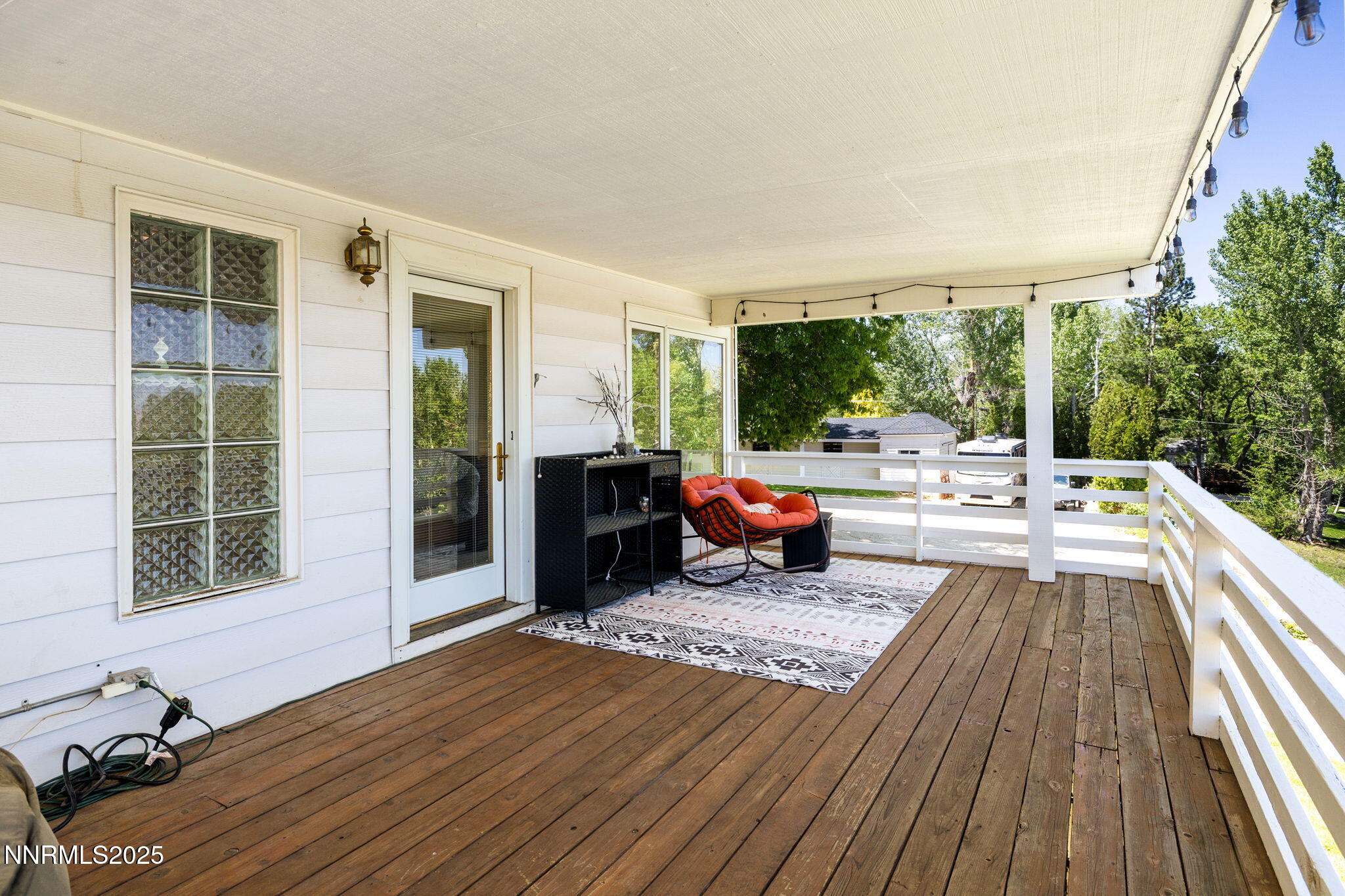 1855 Sierra Sage Lane Reno, NV 89509 - Photo 29 of 34 a living room with furniture floor to ceiling window and wooden floor