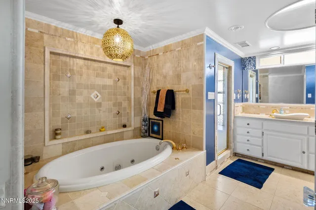 a spacious bathroom with double sink a large mirror and a window