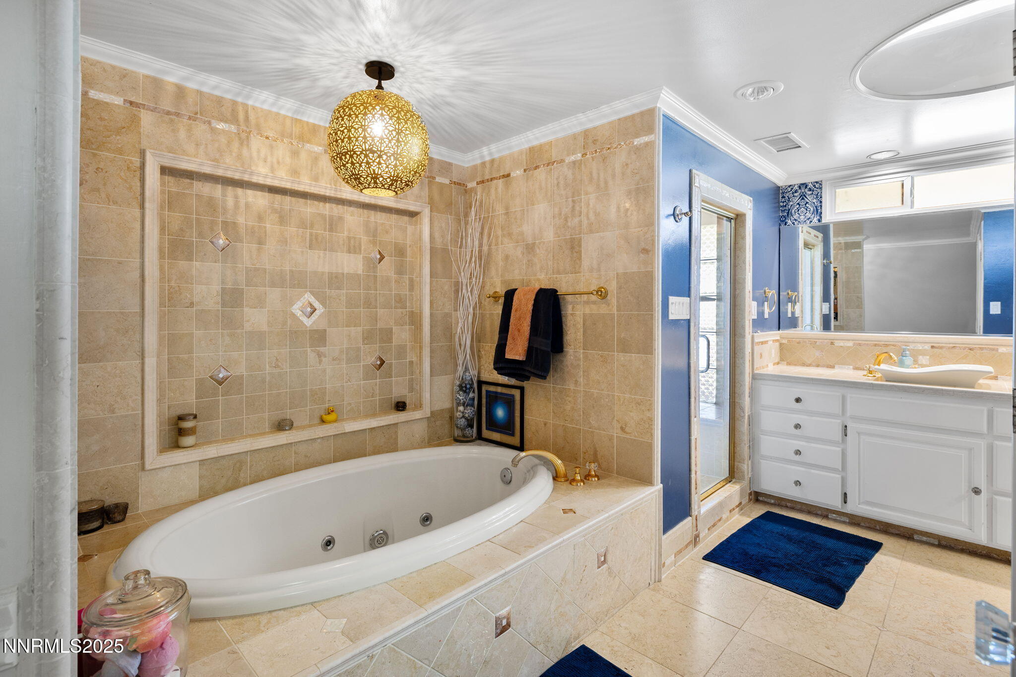 1855 Sierra Sage Lane Reno, NV 89509 - Photo 30 of 34 a bathroom with a tub a sink and a large mirror