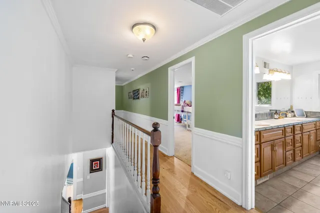 a bedroom with bed and a large window