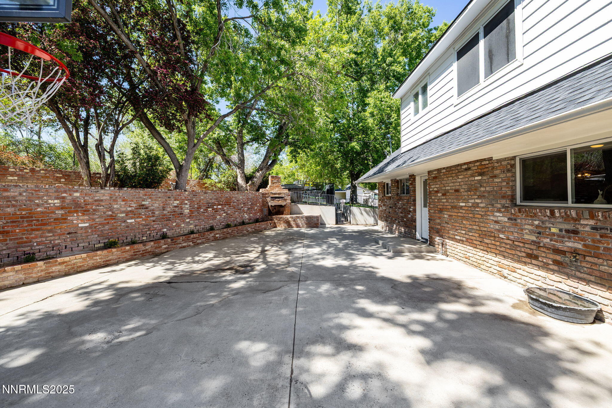 1855 Sierra Sage Lane Reno, NV 89509 - Photo 6 of 34 a view of a backyard with a large tree