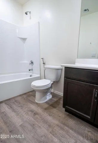 a bathroom with a sink a toilet and bathtub