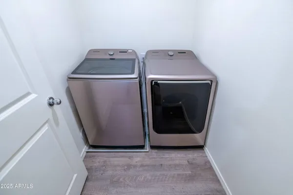 a utility room with dryer and washer