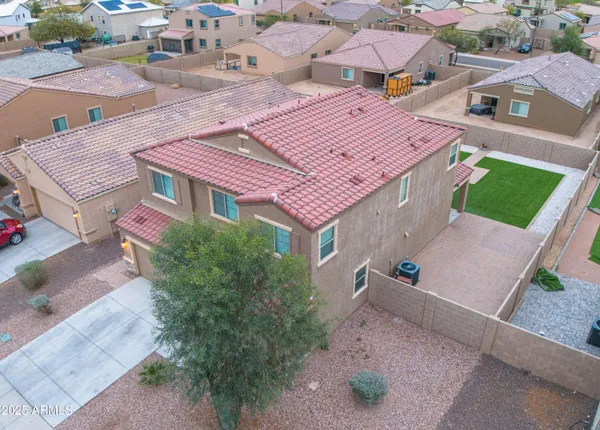 an aerial view of a house with a garden